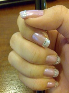 Metallic mauve base, pearlised french tip and little \'crystals\' stick-ons I bought for US$3 for 4 packs in a street market in Mumbai